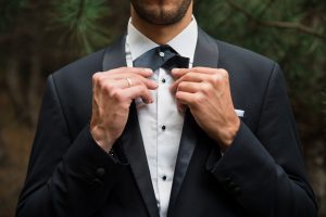 Groom at wedding tuxedo in the forest